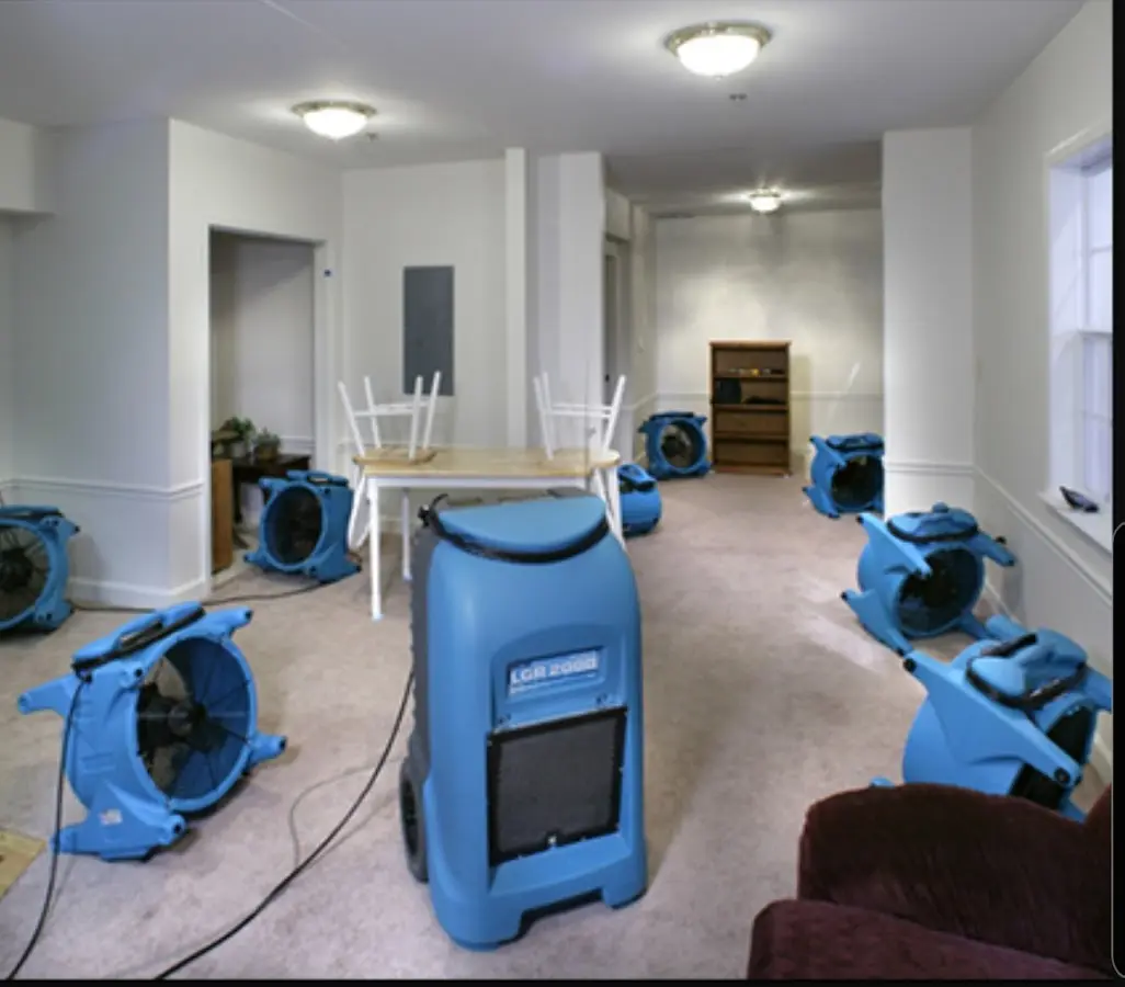 Air movers and dehumidifier setup for Water Damage Restoration in Mason